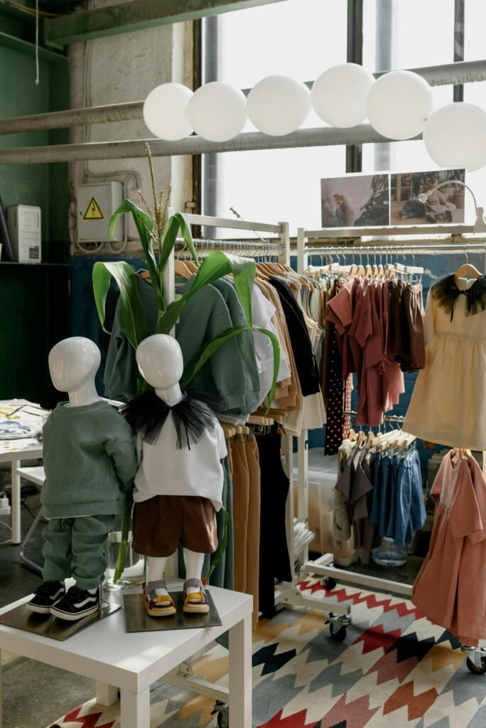 Modern kids clothing store with stylish outfits on display. Perfect for trendy children's fashion.